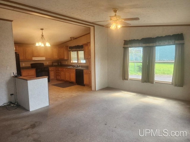 kitchen featuring a sink, under cabinet range hood, black appliances, and a healthy amount of sunlight