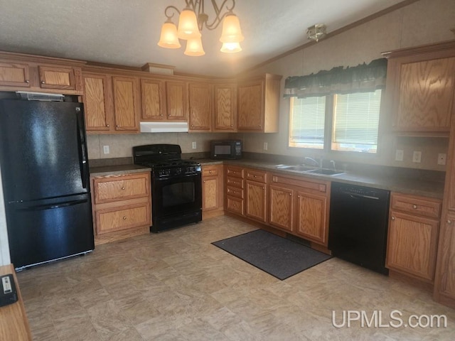 kitchen with vaulted ceiling, a sink, black appliances, an inviting chandelier, and under cabinet range hood