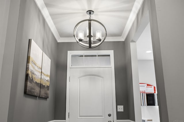 foyer entrance featuring a notable chandelier
