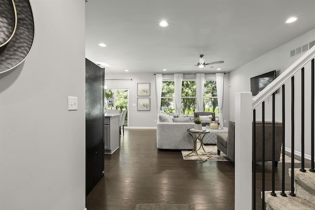 living room with visible vents, stairway, recessed lighting, dark wood-type flooring, and a ceiling fan
