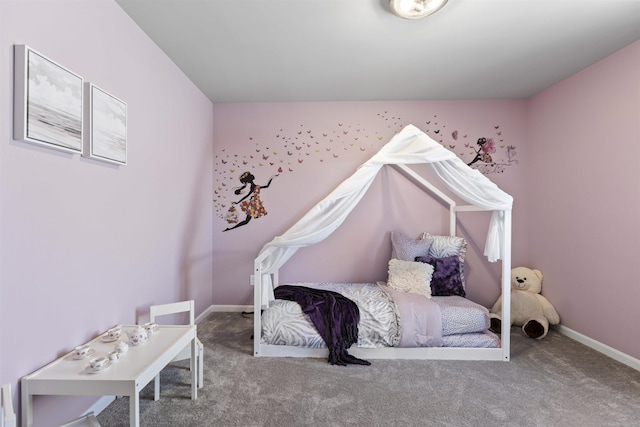 carpeted bedroom featuring baseboards