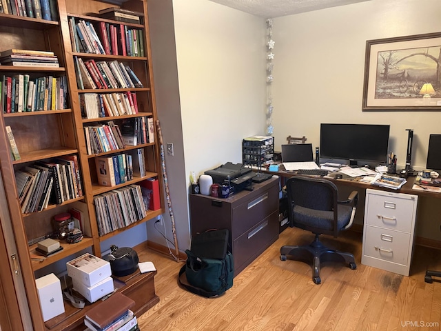 office space with wood finished floors