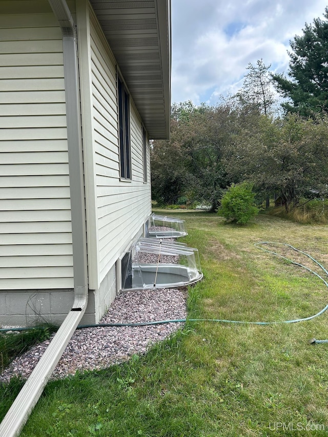 view of home's exterior featuring a lawn