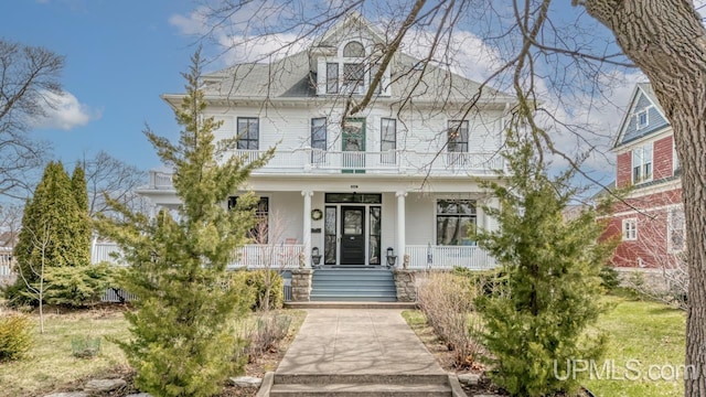 view of front of house with covered porch and a balcony