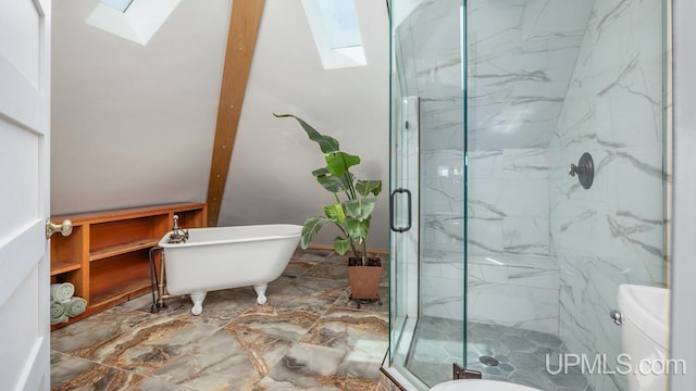 full bath featuring marble finish floor, a marble finish shower, toilet, and a skylight
