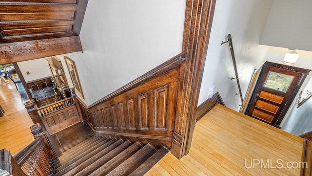 staircase featuring wood-type flooring