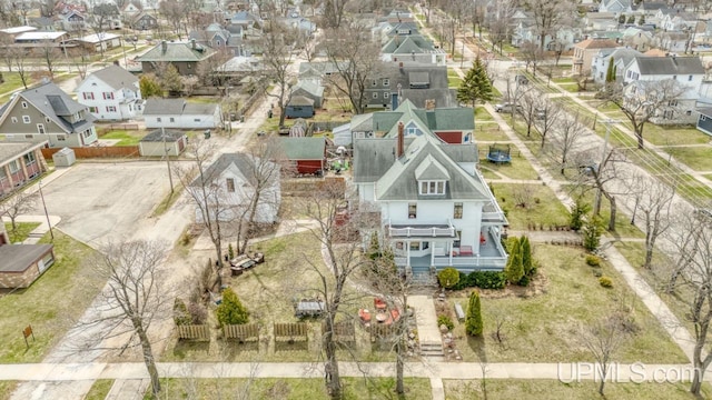 birds eye view of property with a residential view