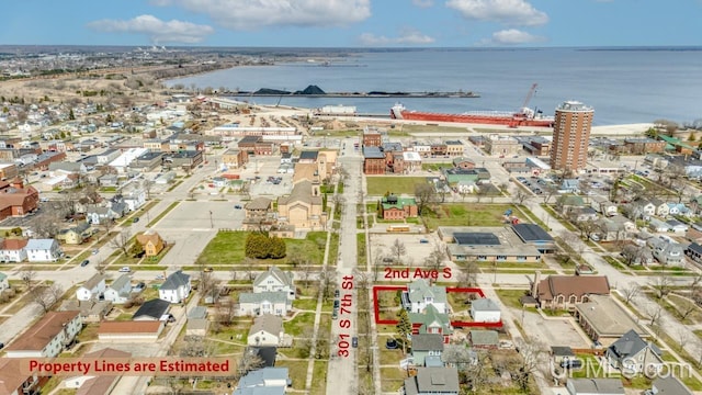 birds eye view of property featuring a water view
