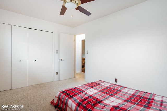 bedroom with ceiling fan and a closet