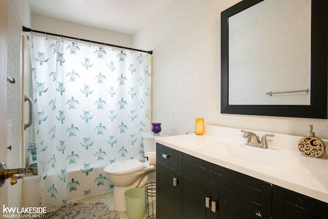 bathroom featuring toilet, shower / bath combo with shower curtain, tile patterned flooring, and vanity