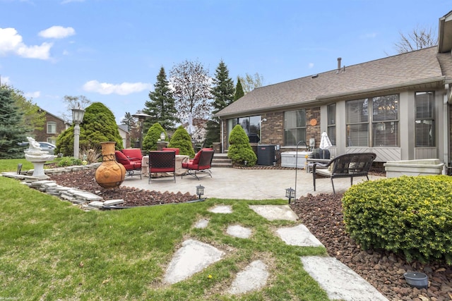 view of yard featuring a patio and cooling unit