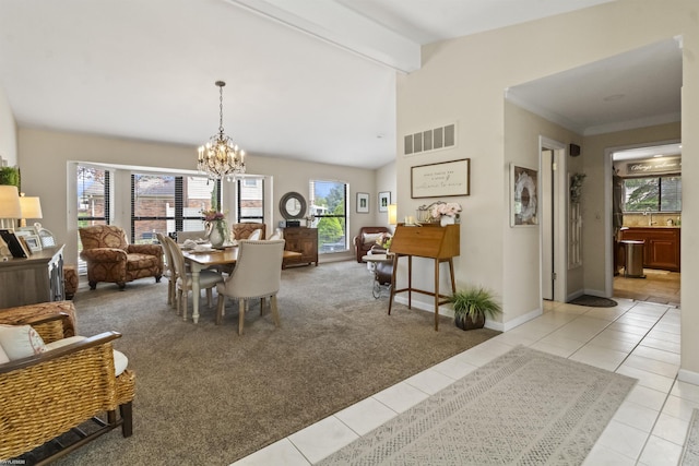 carpeted dining room featuring visible vents, tile patterned flooring, baseboards, a sink, and a notable chandelier