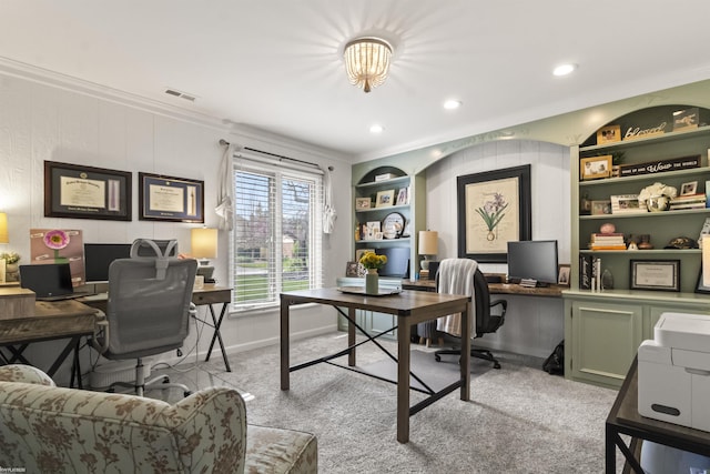 office with visible vents, built in features, ornamental molding, light carpet, and recessed lighting
