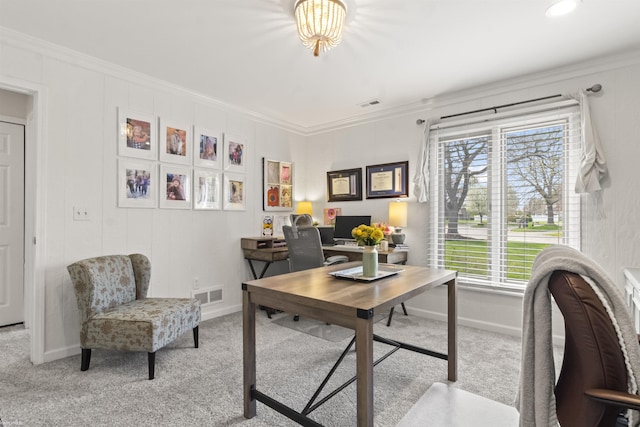 office with crown molding, carpet flooring, and visible vents