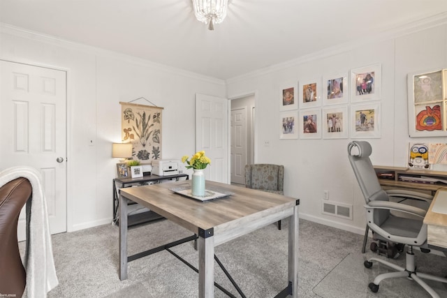 office area with baseboards, ornamental molding, light carpet, and visible vents