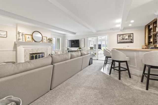 living room featuring indoor bar, recessed lighting, beam ceiling, and a fireplace