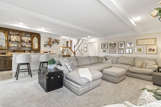 living room featuring recessed lighting, indoor bar, stairway, and beamed ceiling