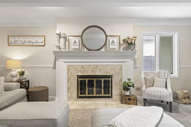 carpeted living room with baseboards and a tile fireplace
