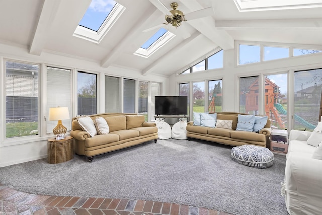 sunroom / solarium with a skylight and beam ceiling