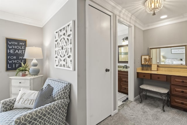 sitting room featuring baseboards, ornamental molding, and carpet