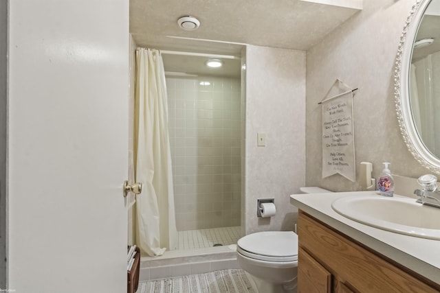 bathroom with vanity, tile patterned floors, toilet, and a shower stall