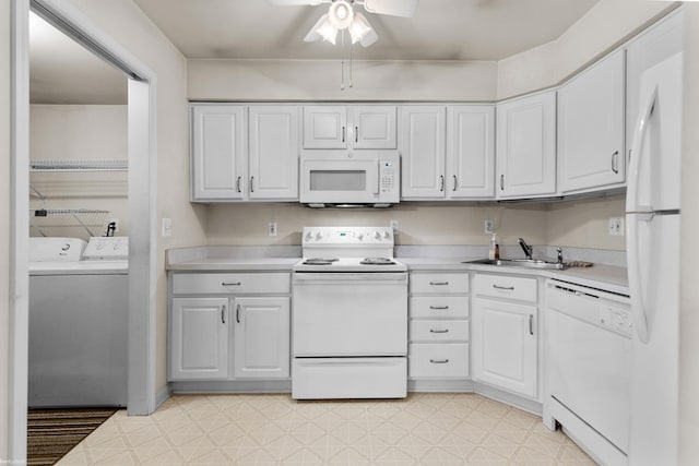 kitchen featuring white appliances, a sink, washer and clothes dryer, and light countertops