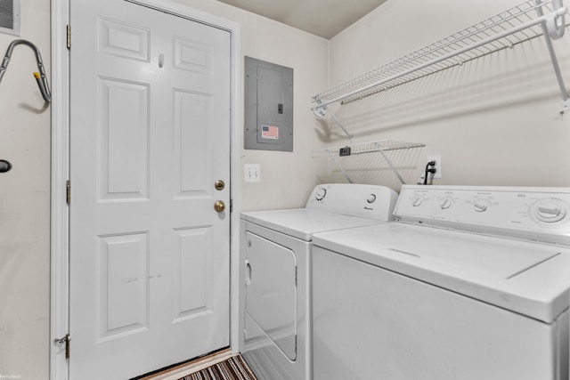 clothes washing area with independent washer and dryer, laundry area, and electric panel