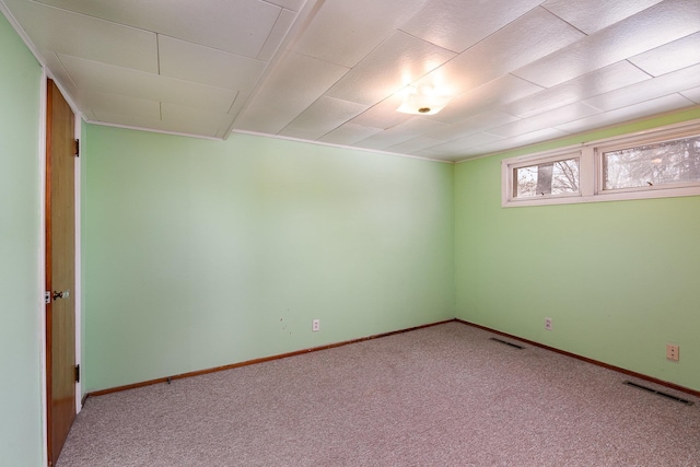 empty room featuring carpet flooring and visible vents