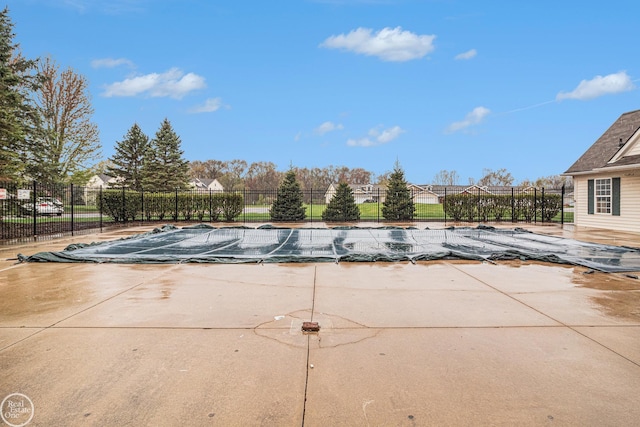 view of pool featuring a fenced in pool, fence, and a patio