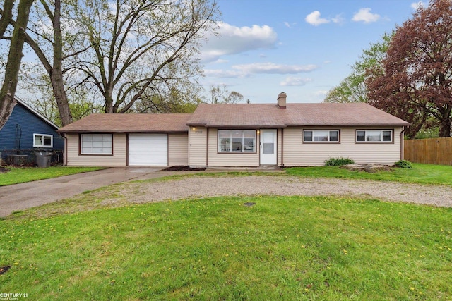 ranch-style home featuring a front lawn, fence, driveway, and a chimney
