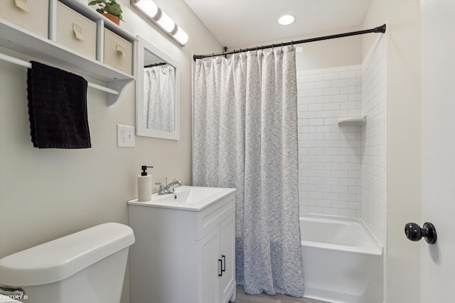 bathroom with vanity, toilet, shower / bathtub combination with curtain, and wood finished floors