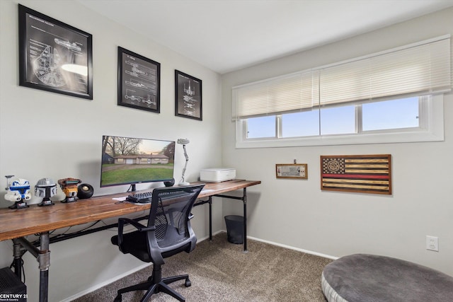 carpeted office space with baseboards