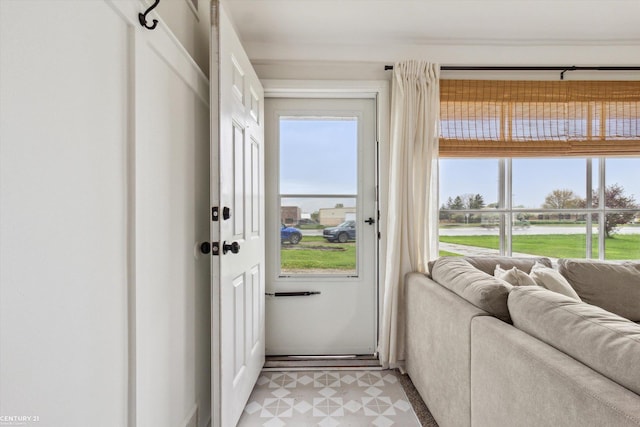 entryway featuring light floors and a healthy amount of sunlight