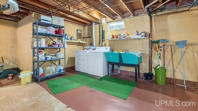 basement with washer and clothes dryer