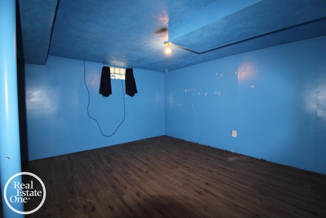 empty room featuring dark wood finished floors