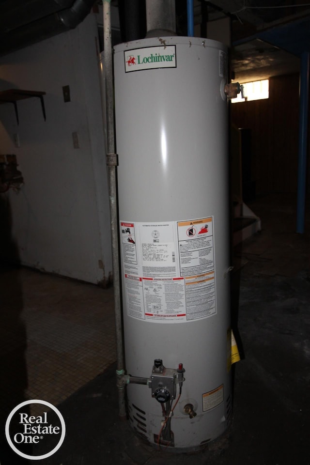 utility room featuring gas water heater