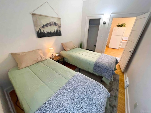 bedroom featuring a closet and wood finished floors