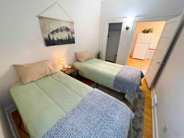 225 E Ridge St, Ironwood, MI 49938 - bedroom featuring a closet and wood finished floors