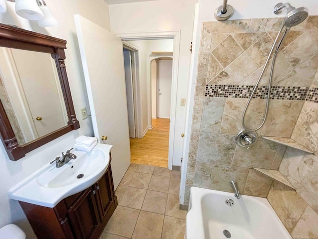 bathroom featuring vanity, bathtub / shower combination, and tile patterned floors