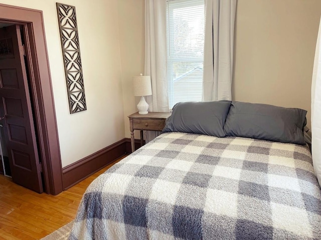 bedroom with light wood-style flooring