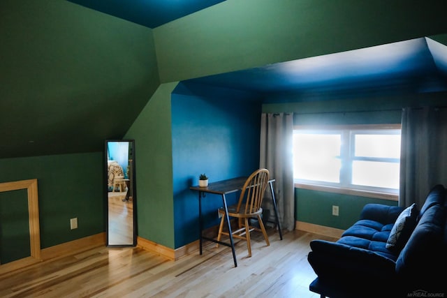 office with baseboards, wood finished floors, and lofted ceiling