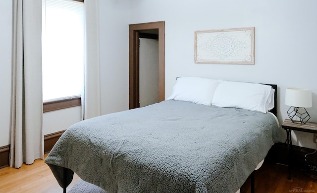 bedroom featuring wood finished floors