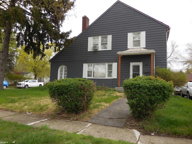 view of side of property featuring a chimney