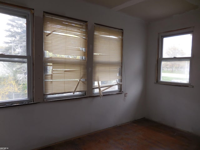 empty room with dark wood finished floors