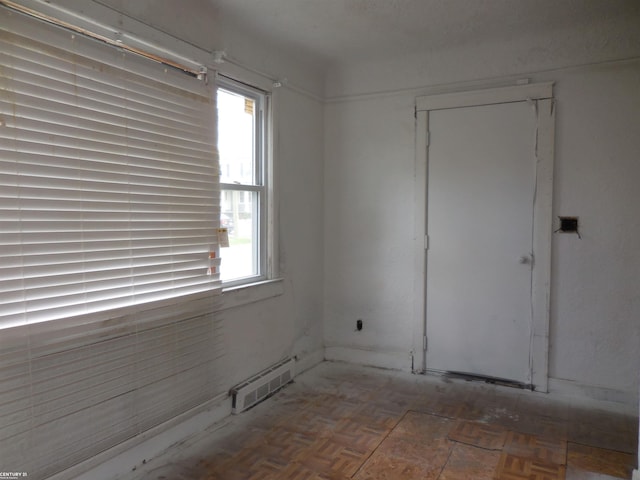 unfurnished room with visible vents and a healthy amount of sunlight