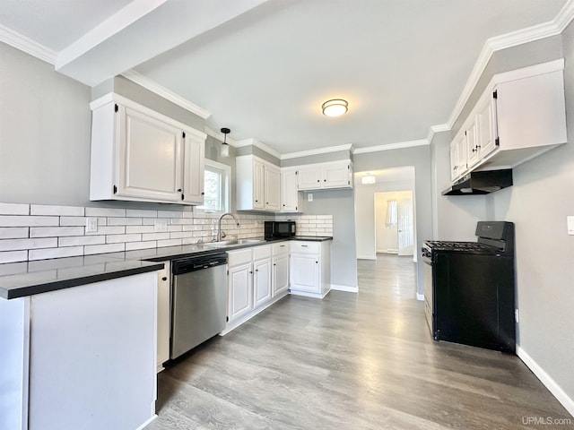 kitchen featuring decorative backsplash, dark countertops, a sink, black appliances, and light wood-style floors
