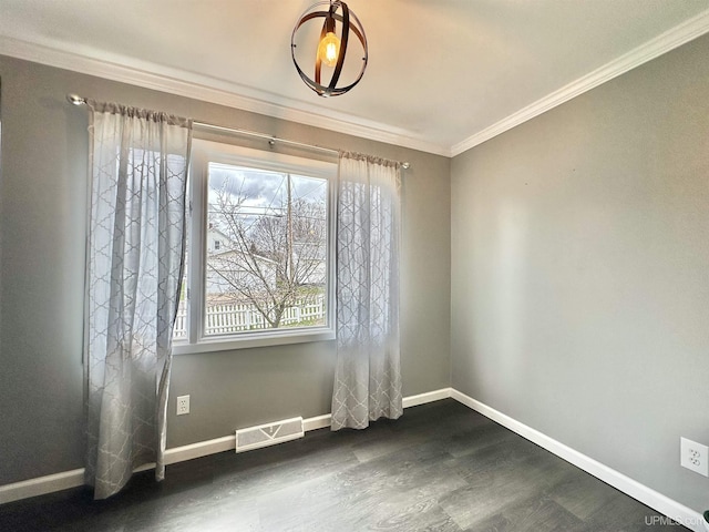 unfurnished room featuring crown molding, baseboards, visible vents, and dark wood finished floors