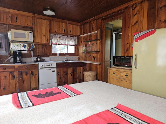 kitchen with brown cabinetry, open shelves, a toaster, white appliances, and light countertops