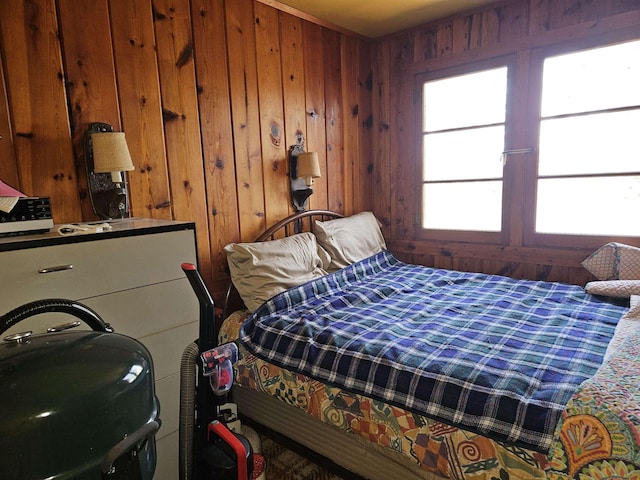 bedroom with wooden walls
