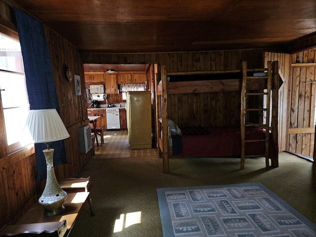 living room featuring wood walls, wood ceiling, and dark colored carpet